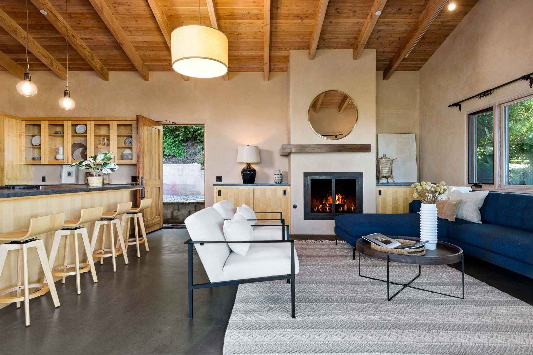 356 East Mountain Drive Montecito, CA 93108 - Photo 4 of 36 a living room with furniture a fireplace and a large window