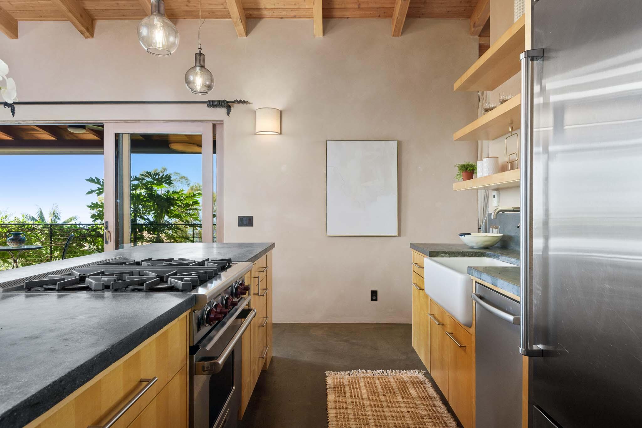 356 East Mountain Drive Montecito, CA 93108 - Photo 5 of 36 a kitchen with stainless steel appliances granite countertop a stove a sink and a refrigerator