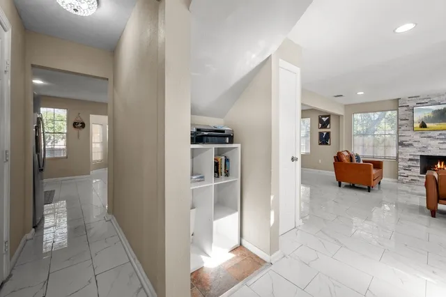 a bedroom with furniture and a chandelier