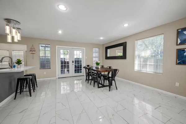 a bathroom with a sink a toilet a mirror a vanity and shower