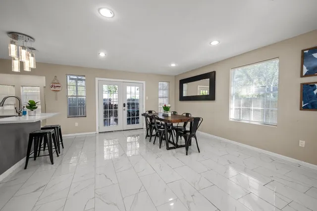 a bathroom with a sink a toilet a mirror a vanity and shower