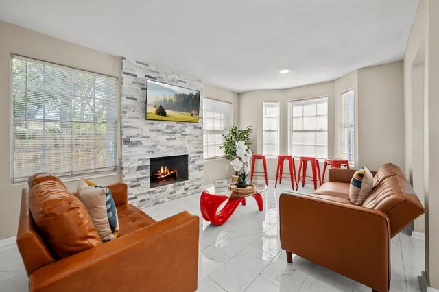 a bedroom with a bed and a lamp on table