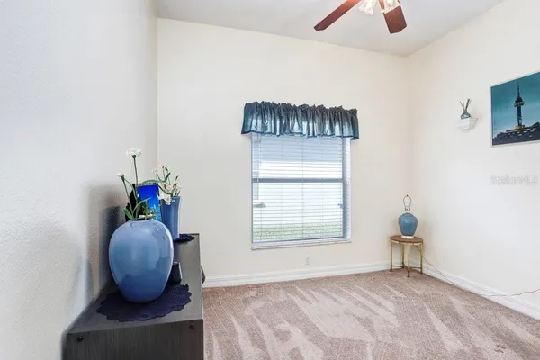 a view of entryway with livingroom and chandelier
