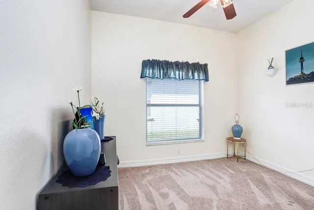 a view of entryway with livingroom and chandelier