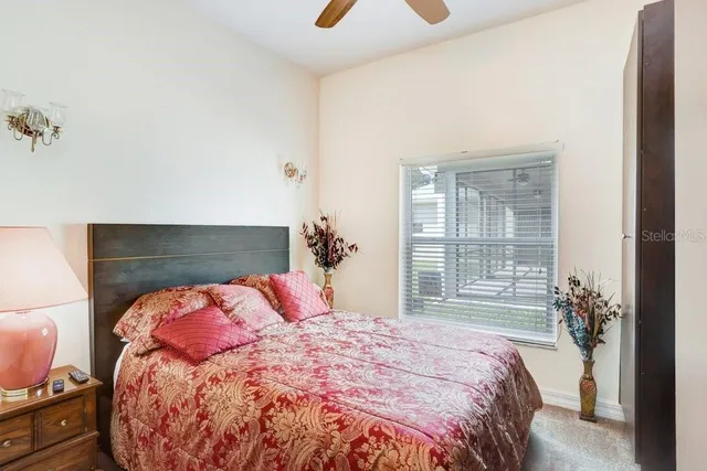 a bedroom with a bed and window