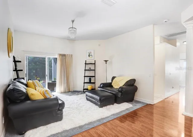 a living room with furniture and a large window
