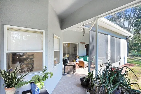 a lobby with furniture and potted plants