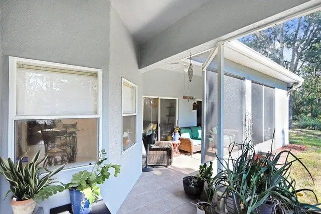 a lobby with furniture and potted plants
