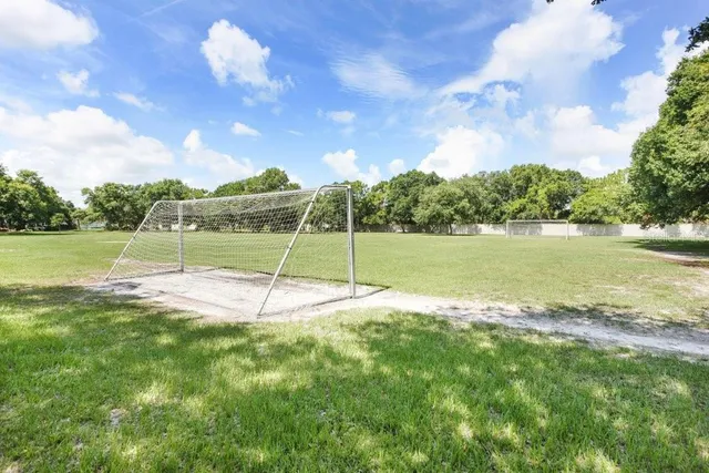 a view of a golf course with a lake