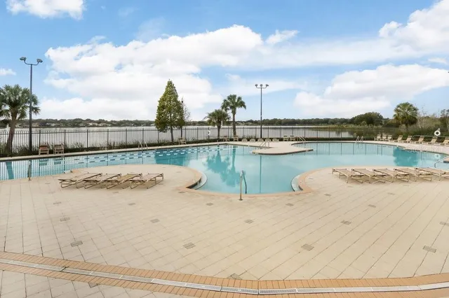 a view of swimming pool with outdoor space and seating area