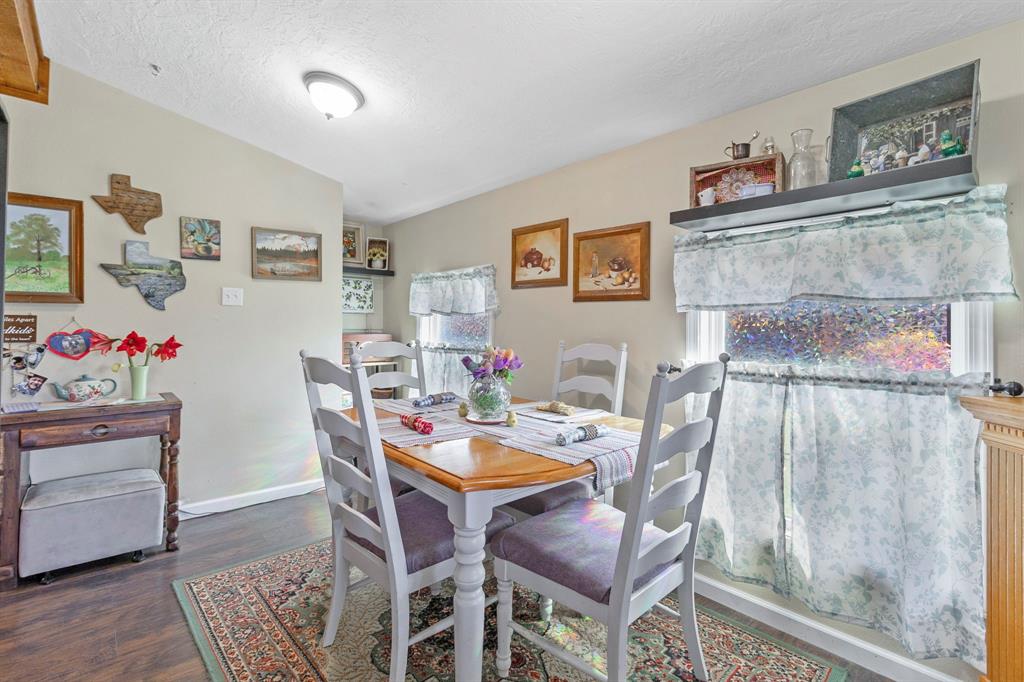 17 Townhouse Lane Trinity, TX 75862 - Photo 13 of 26 a view of a dining room with furniture and wooden floor