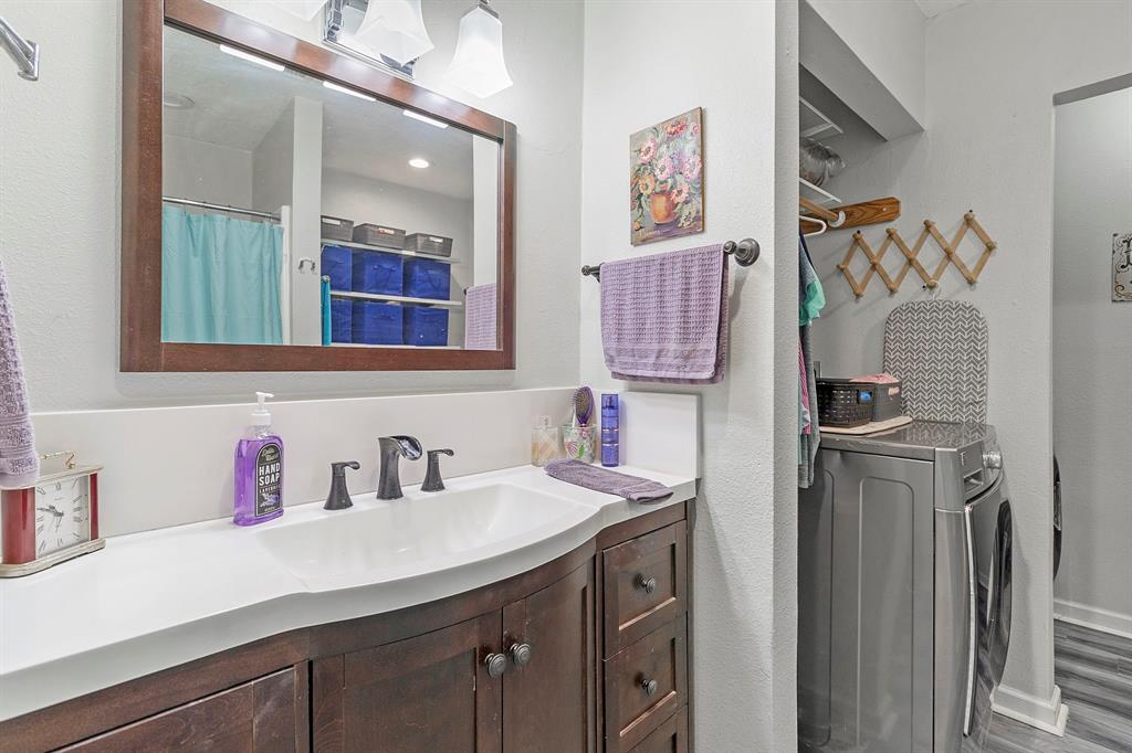 17 Townhouse Lane Trinity, TX 75862 - Photo 23 of 26 a bathroom with a sink and a mirror