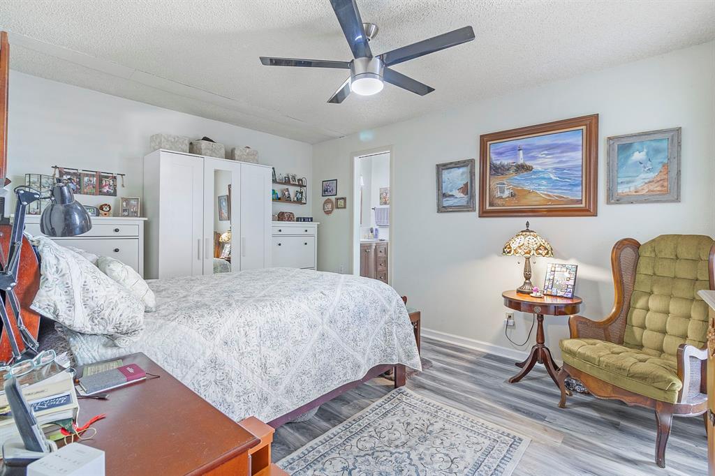 17 Townhouse Lane Trinity, TX 75862 - Photo 25 of 26 a bed room with a bed and a chair