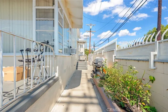 a kitchen with stainless steel appliances granite countertop a refrigerator and a stove