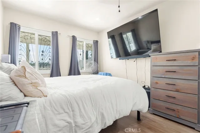 a bedroom with a bed and a chair