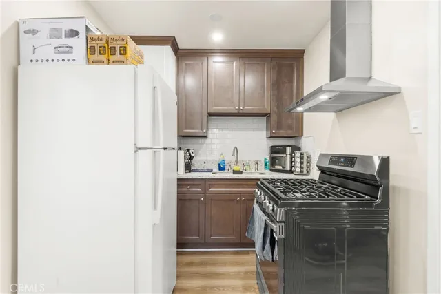 a white toilet sitting next to a bathroom sink