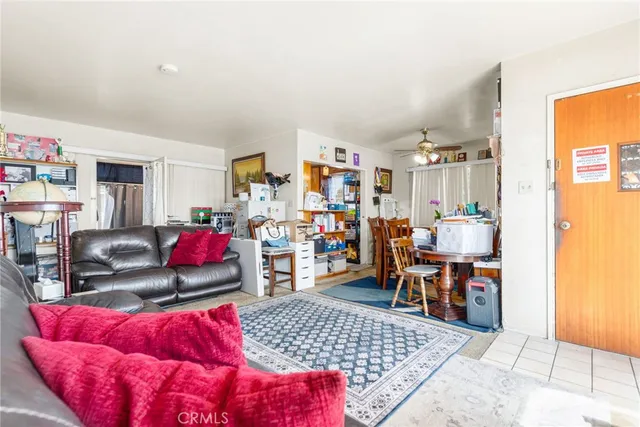 a view of a livingroom with furniture and a flat screen tv