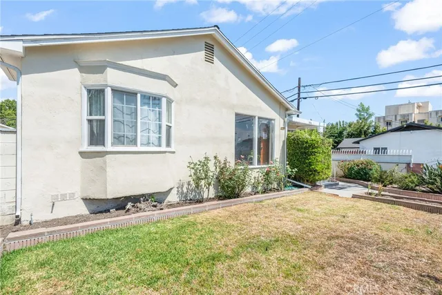 a view of a house with outdoor seating space