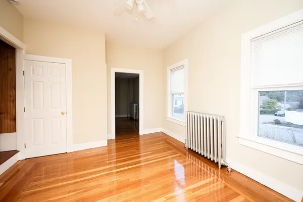 a view of a bedroom from a hallway
