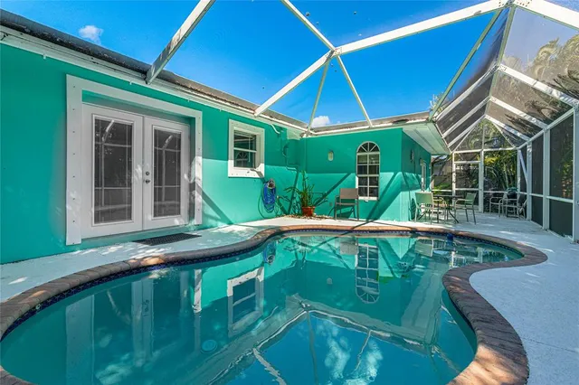 a view of a swimming pool with a patio