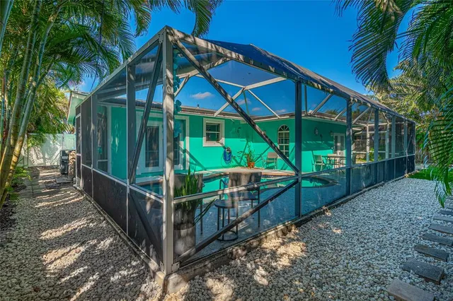 a view of a house with backyard and deck