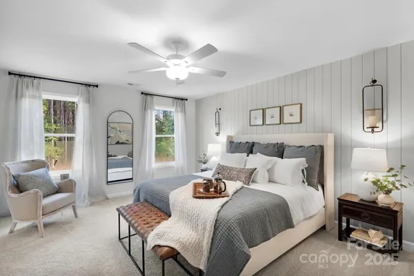 a bedroom with a bed and a couch