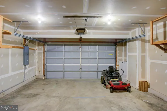 a bathroom with a sink a mirror and a shower