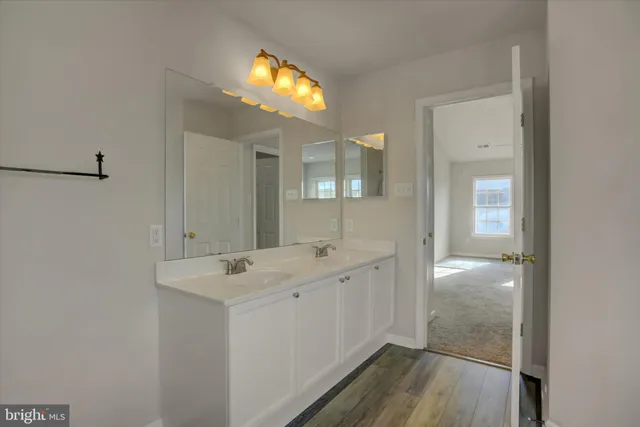 a view of room with a ceiling fan and window
