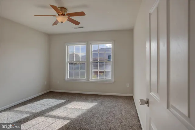 a patio with table and chairs