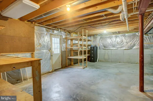 a picture of a bench in front of a wall