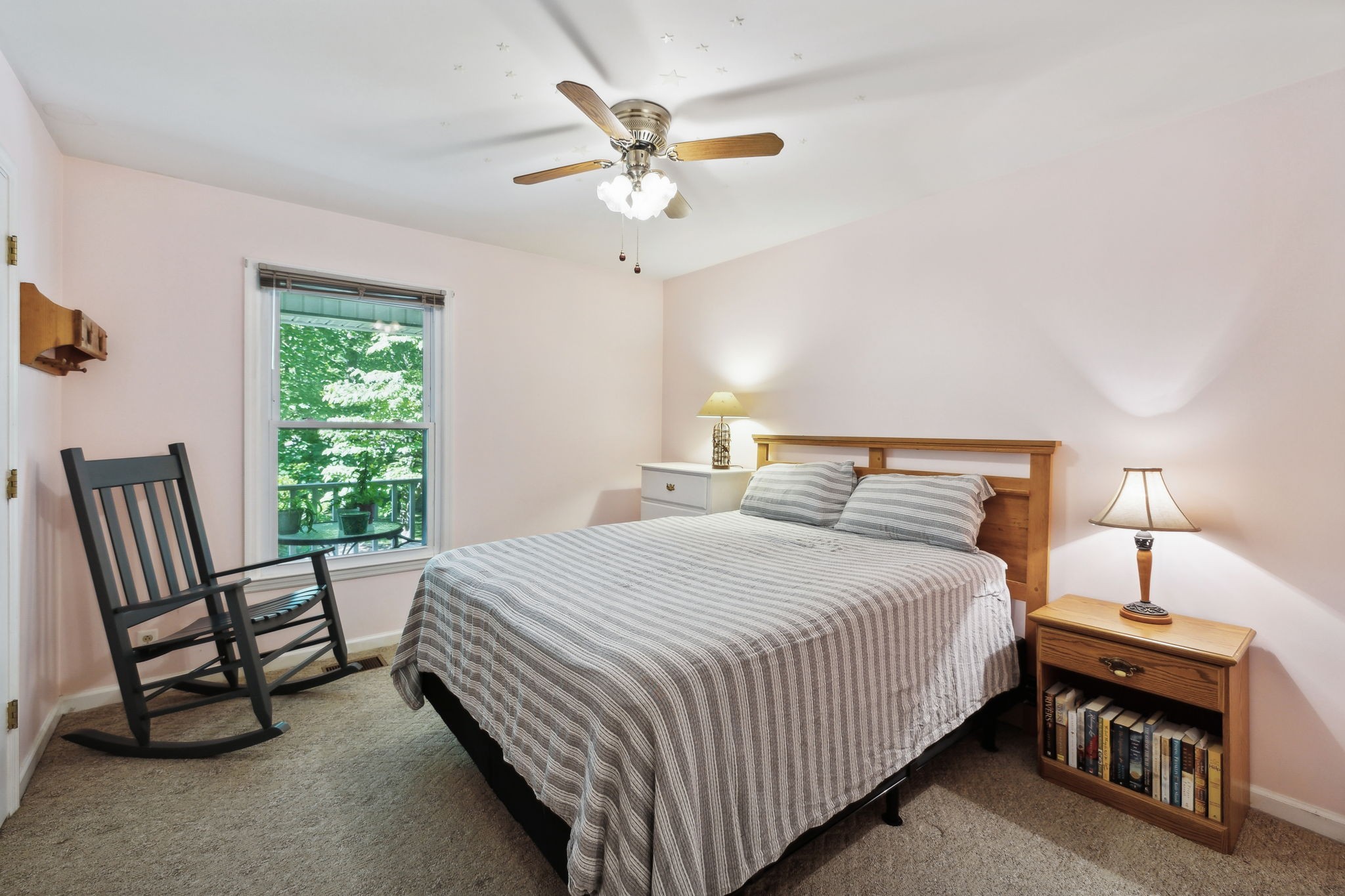7126 Harding Drive Northwest Fairview, TN 37062 - Photo 12 of 22 a bedroom with a bed and a chandelier
