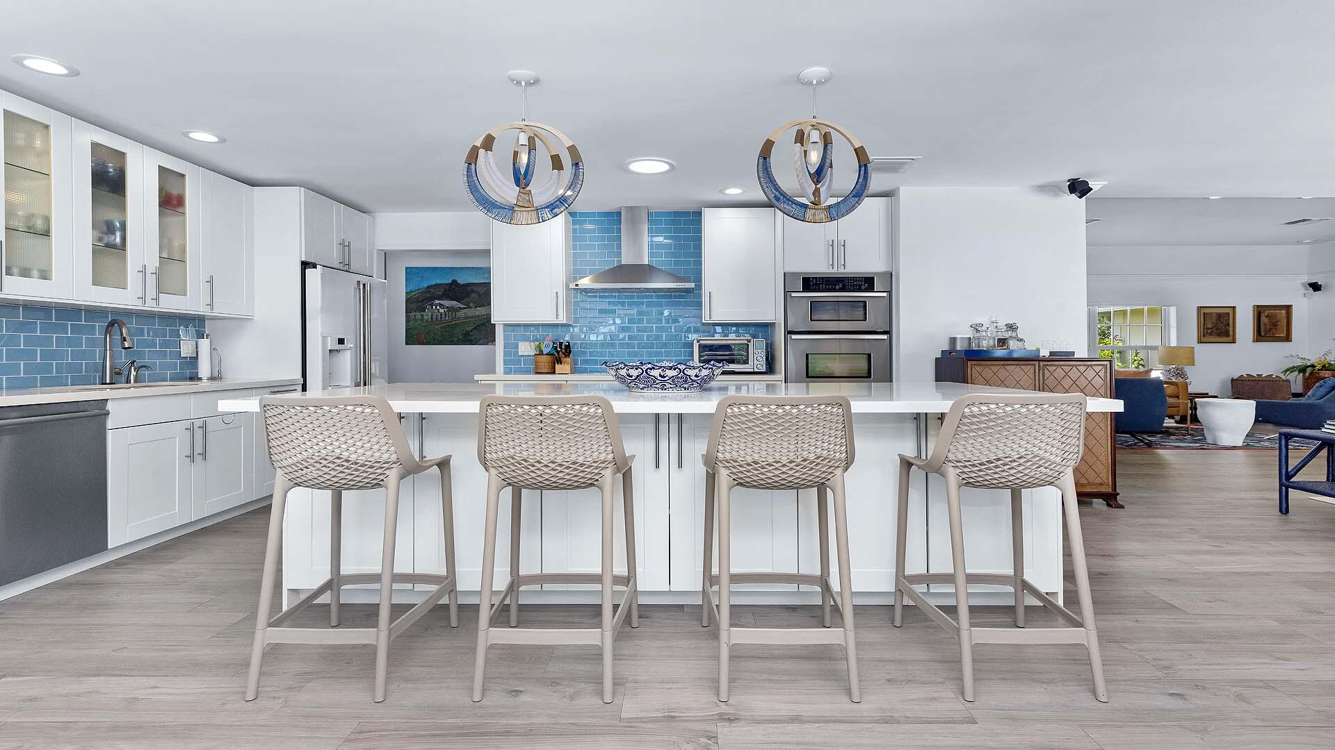 335 Old School Road Gulf Stream, FL 33483 - Photo 11 of 29 a large kitchen with a table and chairs in it