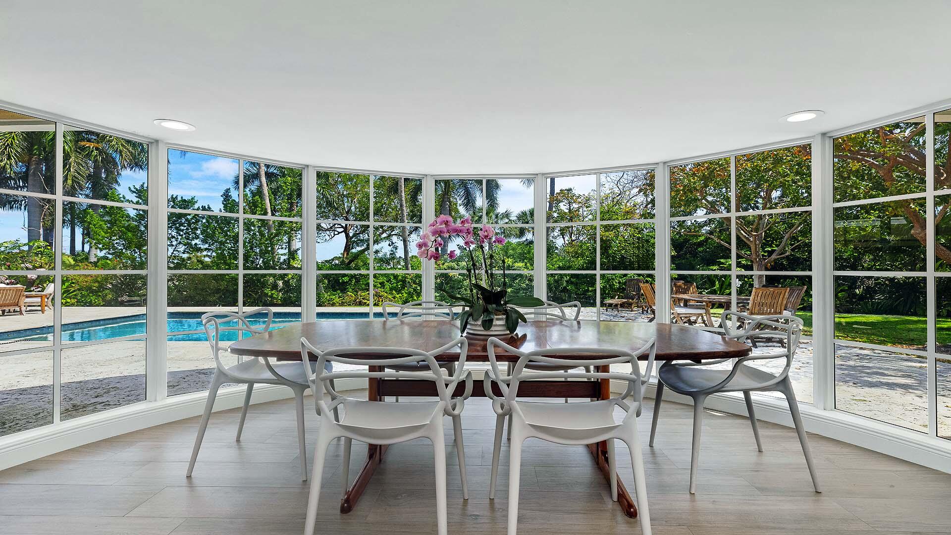 335 Old School Road Gulf Stream, FL 33483 - Photo 15 of 29 a view of a dining room with furniture window and outside view