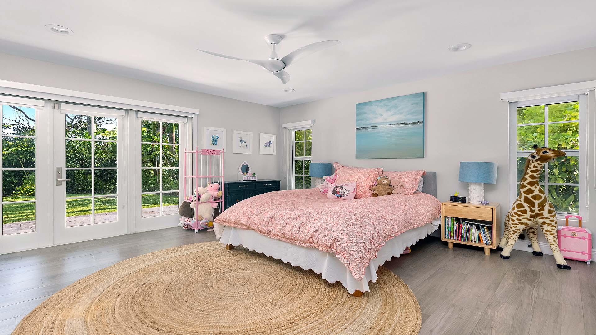 335 Old School Road Gulf Stream, FL 33483 - Photo 20 of 29 a bedroom with a bed and a large window