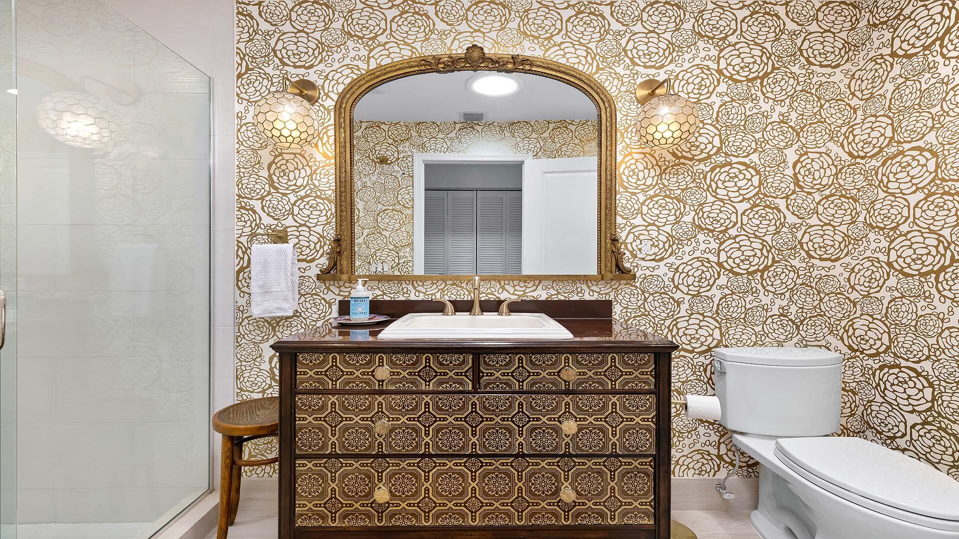 335 Old School Road Gulf Stream, FL 33483 - Photo 21 of 29 a bathroom with a sink a toilet and mirror