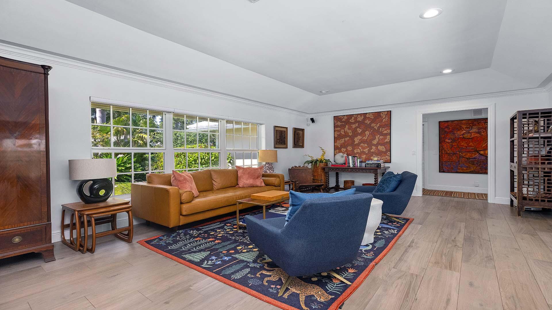 335 Old School Road Gulf Stream, FL 33483 - Photo 9 of 29 a living room with furniture and a large window