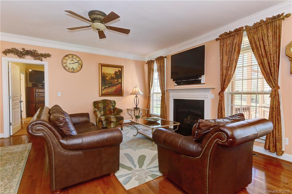 4172 Sunset Ridge Drive Rock Hill, SC 29732 - Photo 13 of 35 a living room with furniture a flat screen tv and a fireplace