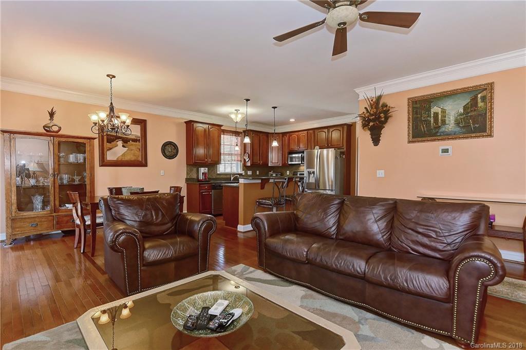 4172 Sunset Ridge Drive Rock Hill, SC 29732 - Photo 15 of 35 a living room with furniture kitchen view and a chandelier