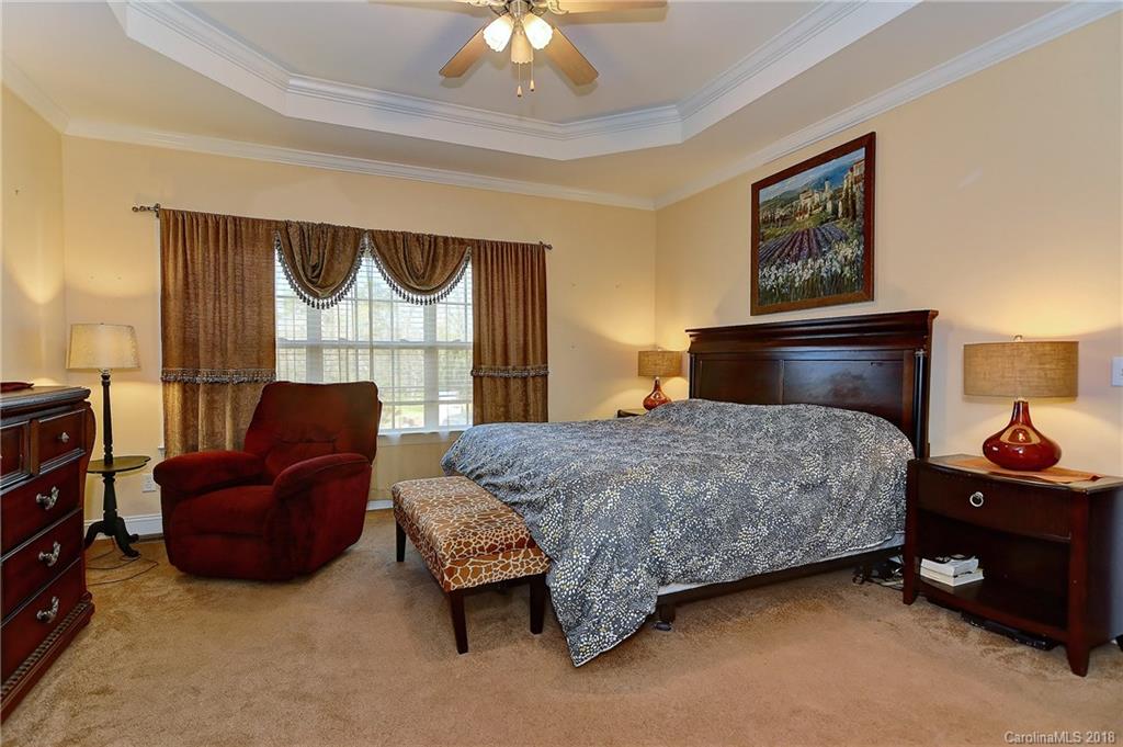 4172 Sunset Ridge Drive Rock Hill, SC 29732 - Photo 16 of 35 a bedroom with a bed dresser and a window