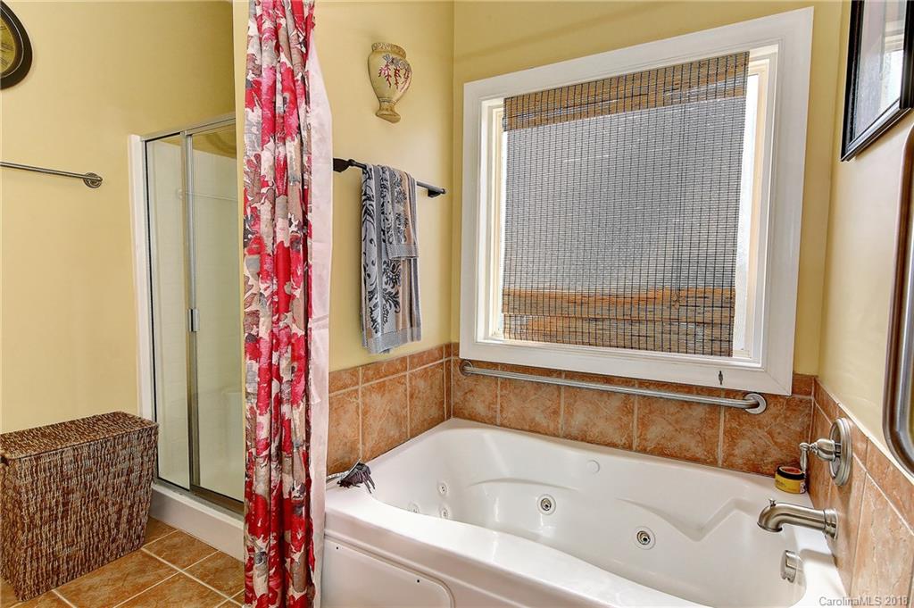 4172 Sunset Ridge Drive Rock Hill, SC 29732 - Photo 19 of 35 a bathroom with a bathtub and shower