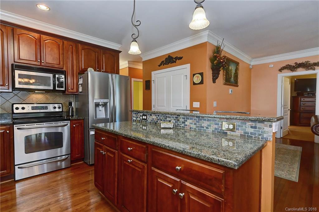 4172 Sunset Ridge Drive Rock Hill, SC 29732 - Photo 8 of 35 a kitchen with stainless steel appliances granite countertop a stove and a sink