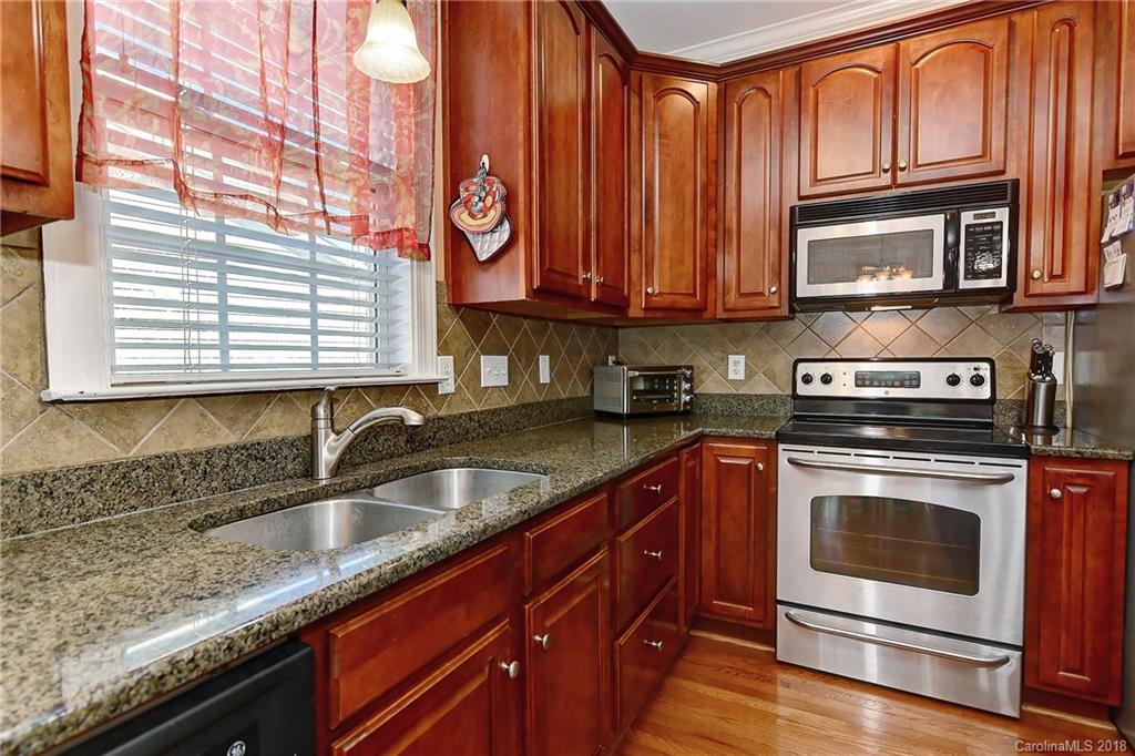 4172 Sunset Ridge Drive Rock Hill, SC 29732 - Photo 9 of 35 a kitchen with stainless steel appliances granite countertop a sink and a stove