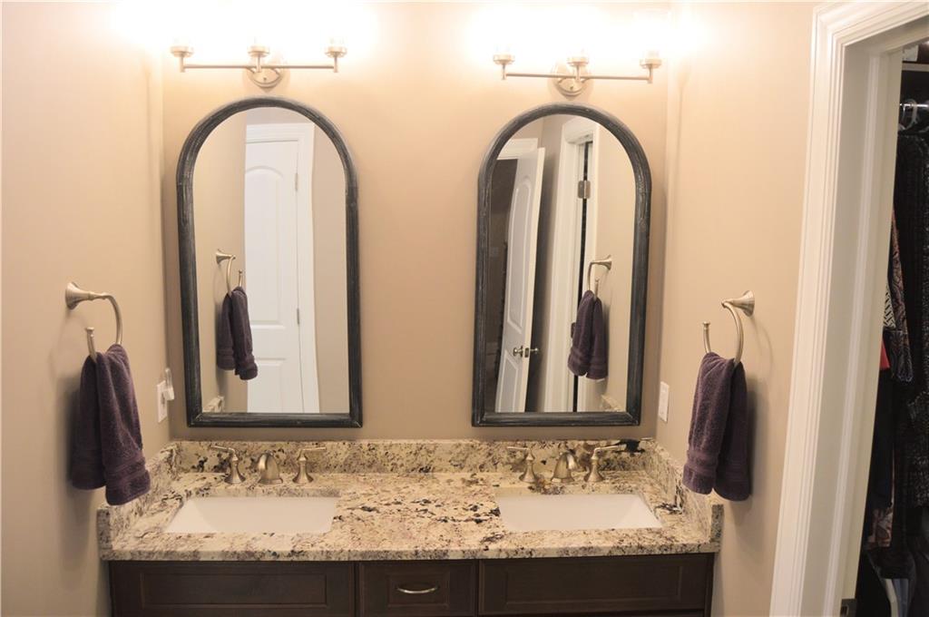 2169 Lovi Road Freedom, PA 15042 - Photo 15 of 25 a bathroom with a granite countertop sink and a mirror