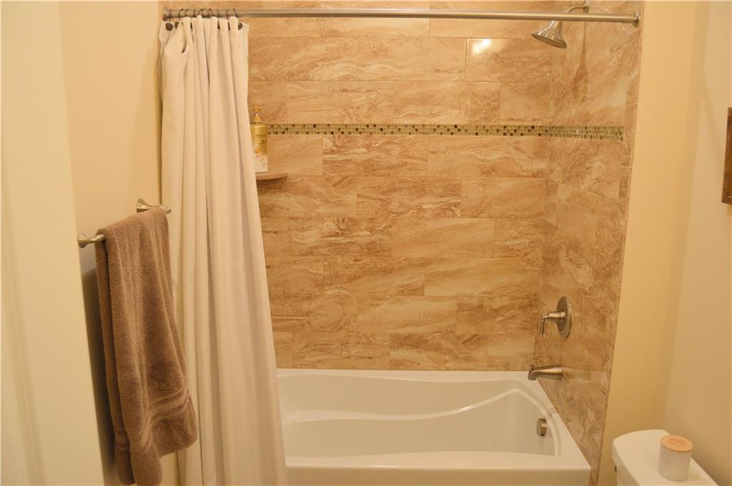 2169 Lovi Road Freedom, PA 15042 - Photo 18 of 25 a bathroom with a shower and a bath tub