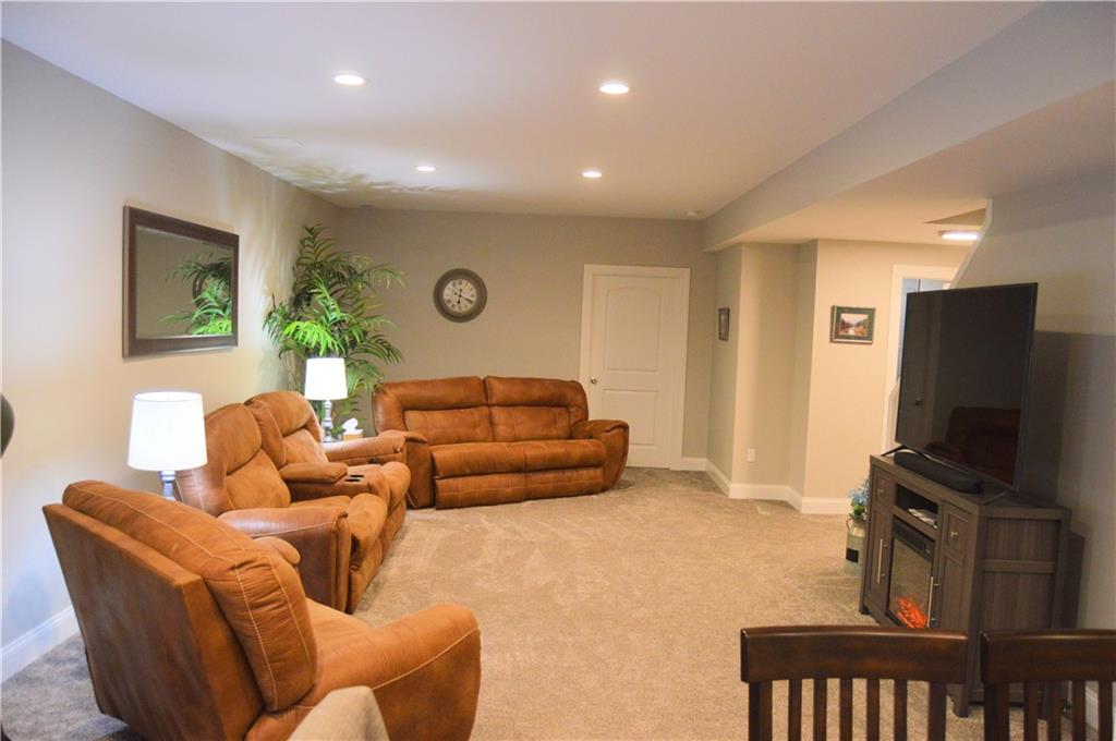 2169 Lovi Road Freedom, PA 15042 - Photo 22 of 25 a living room with furniture a flat screen tv and a window
