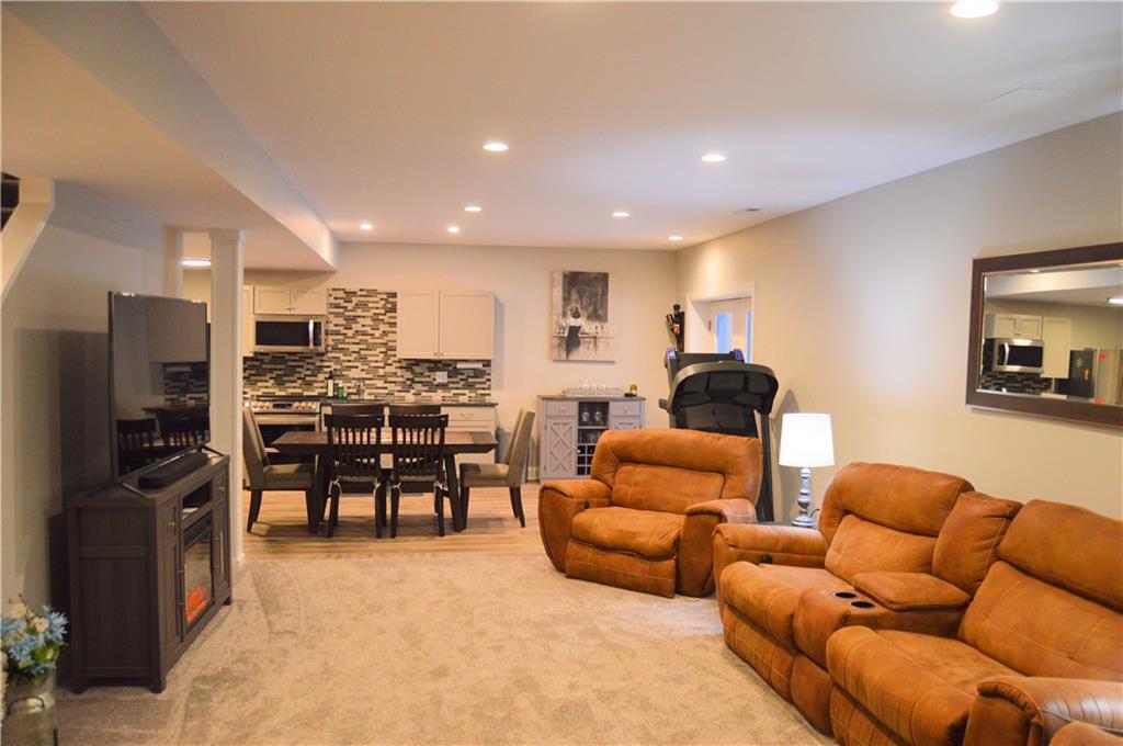 2169 Lovi Road Freedom, PA 15042 - Photo 23 of 25 a living room with furniture kitchen view and a refrigerator