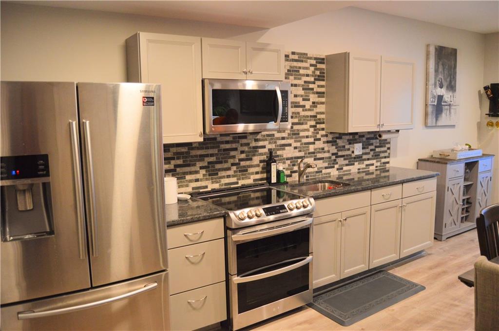 2169 Lovi Road Freedom, PA 15042 - Photo 25 of 25 a kitchen with stainless steel appliances a refrigerator stove and microwave