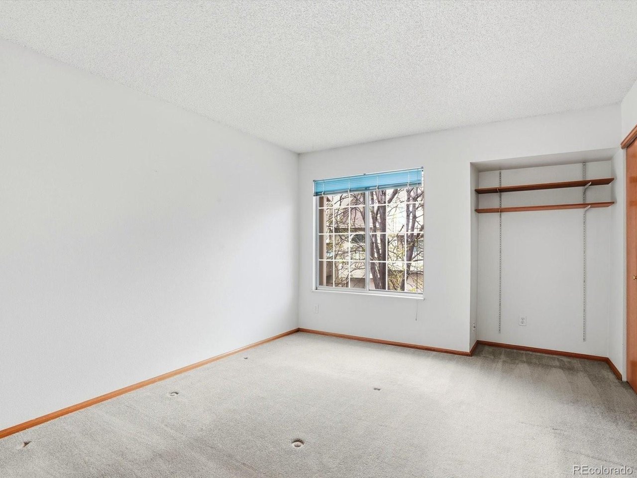 1818 South Quebec Way, Unit 2 Denver, CO 80231 - Photo 11 of 16 an empty room with a window