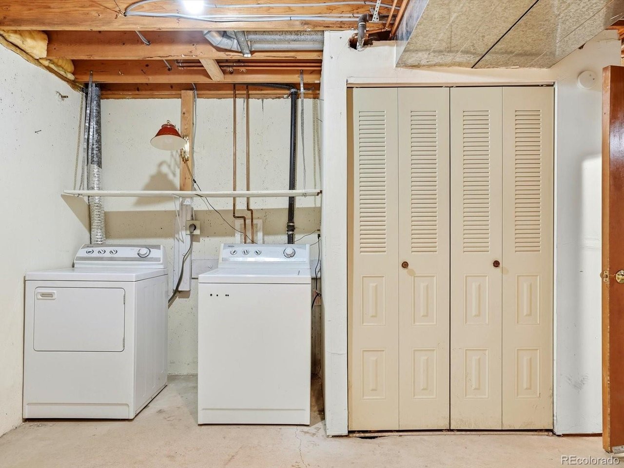 1818 South Quebec Way, Unit 2 Denver, CO 80231 - Photo 14 of 16 a bathroom with a sink a toilet and shower