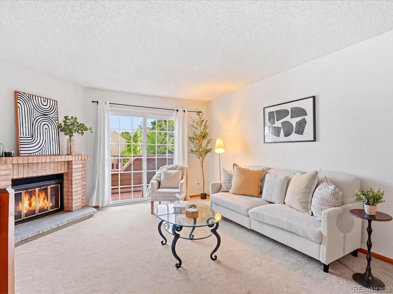 1818 South Quebec Way, Unit 2 Denver, CO 80231 - Photo 4 of 16 a living room with furniture and a fireplace